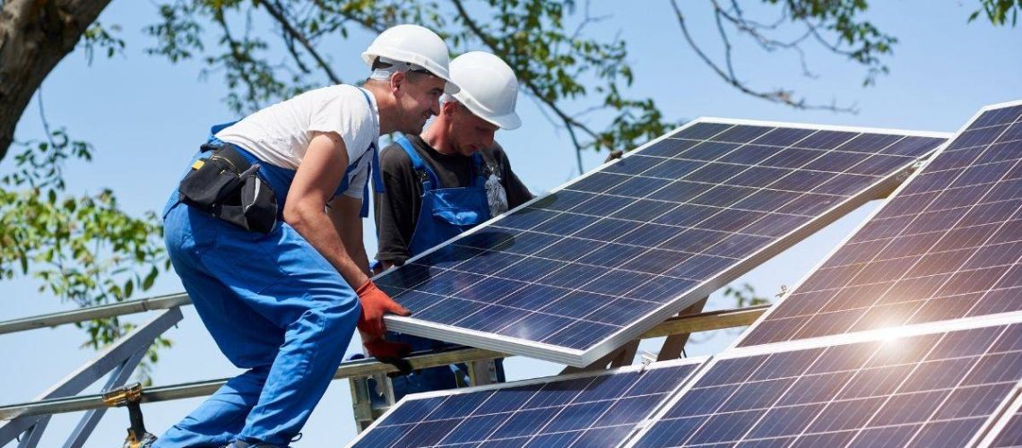 men laying solar panels